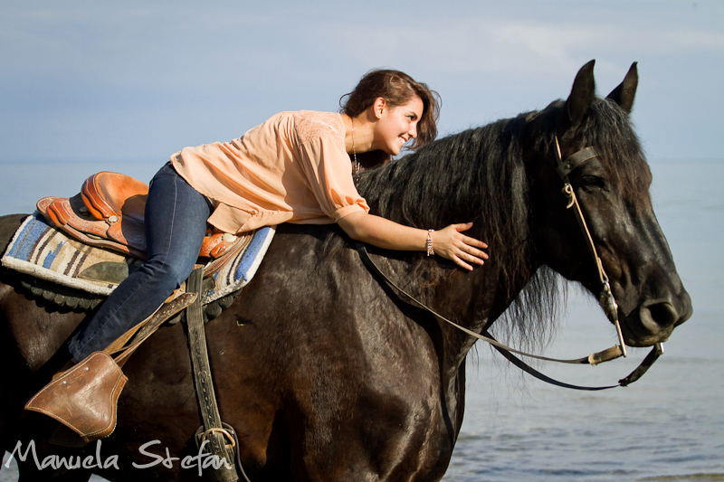 Girl and horse on the beach